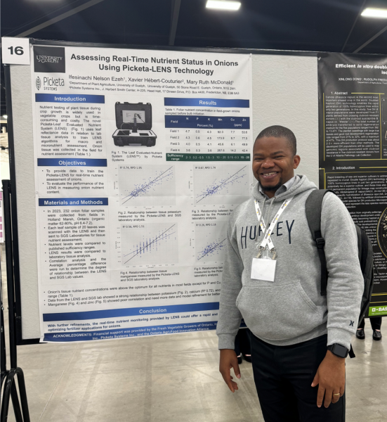 Ifesinachi Nelson Ezeh in front of his 3rd place poster