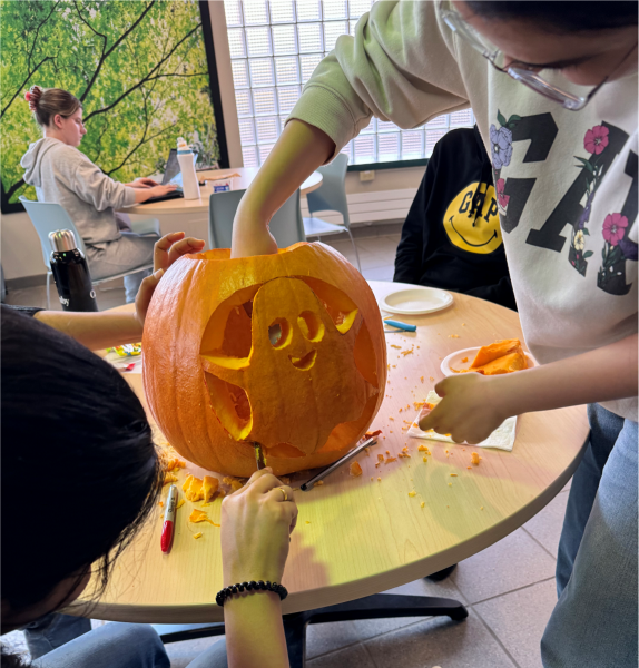 Casper being carved into a pumpkin