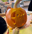 Ghost carved into a pumpkin